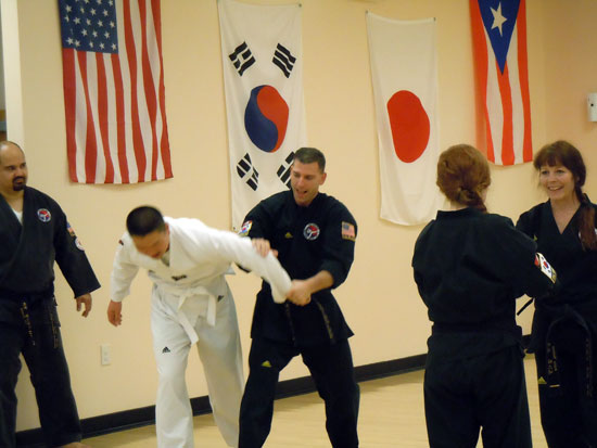 Black Belt Teaching White Belt Martial Arts
