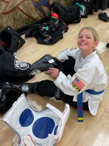 Young lady getting ready for sparring class